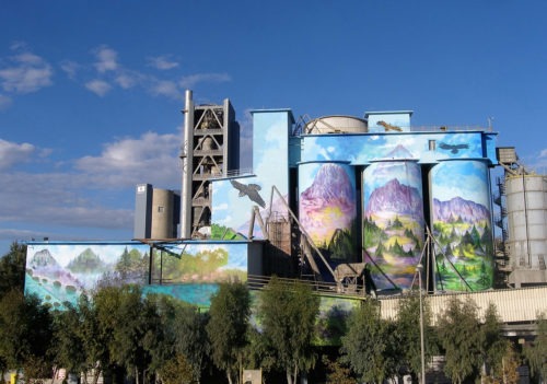 TITAN Thessaloniki facilities painted with colorful graffiti of landscape images, for exterior redesign project