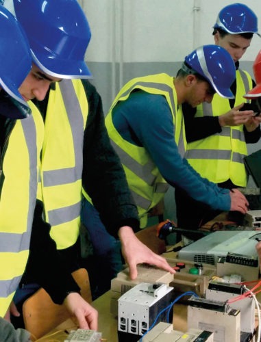 TITAN Usje cement plant internship programs: Young men in protective gear